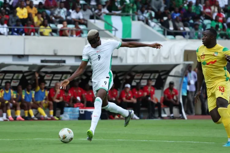 Nigeria's Victor Osimhen scores the first goal of his hat-trick against Benin on Tuesday, October 14 [Sodiq Adelakun/Reuters]