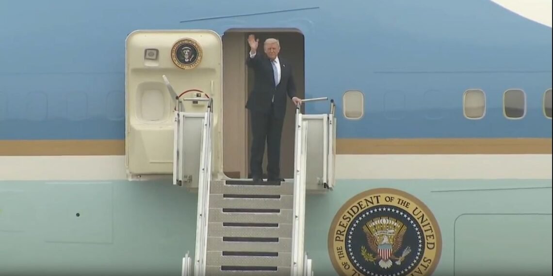 Donald-Trump-waving-from-Air Force One, Trump China summit departure photo