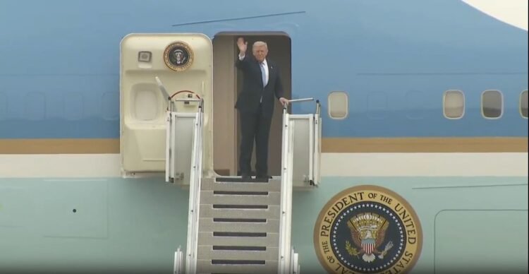 Donald-Trump-waving-from-Air Force One, Trump China summit departure photo